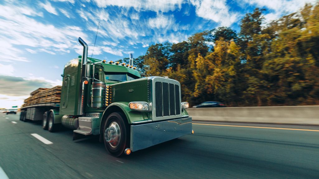 Green Semi Truck on a Highway