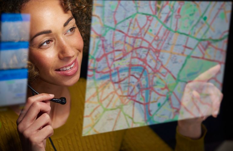 Close Up of Female Dispatcher Looking at a Map