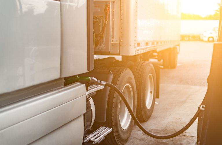 Semi Truck Getting Fuel in the Sun