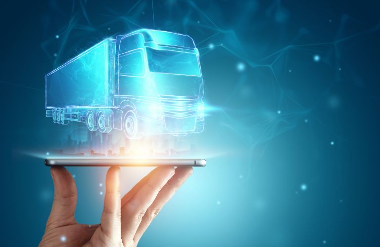 Hand Holding Tablet with Hologram of Semi Truck