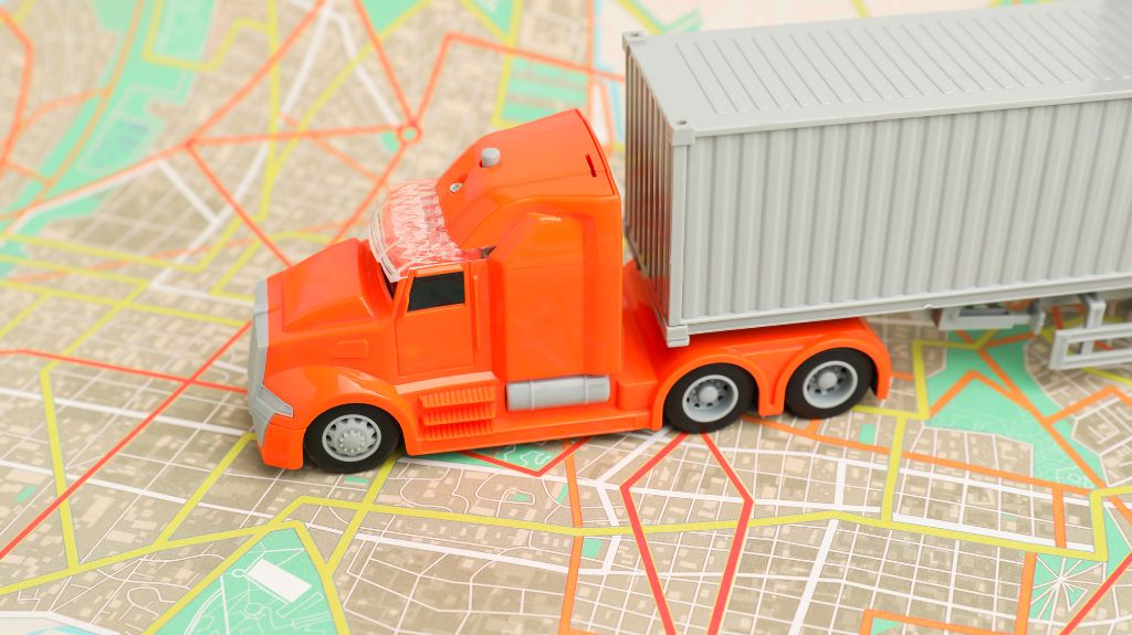 Orange Toy Semi Truck on a Map