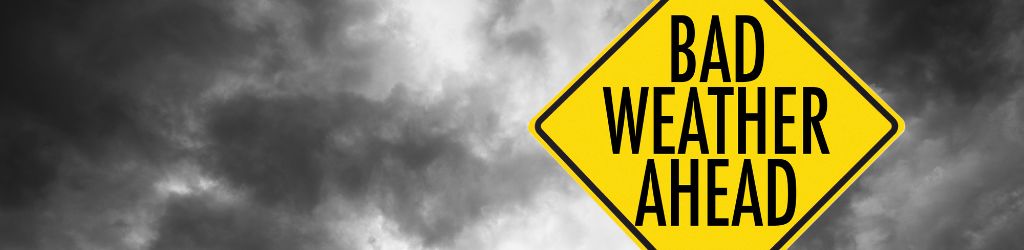 Yellow Bad Weather Ahead Sign with Storm in Background