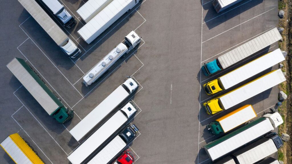 Overhead View of a Parking Lot Full of Semi Trucks