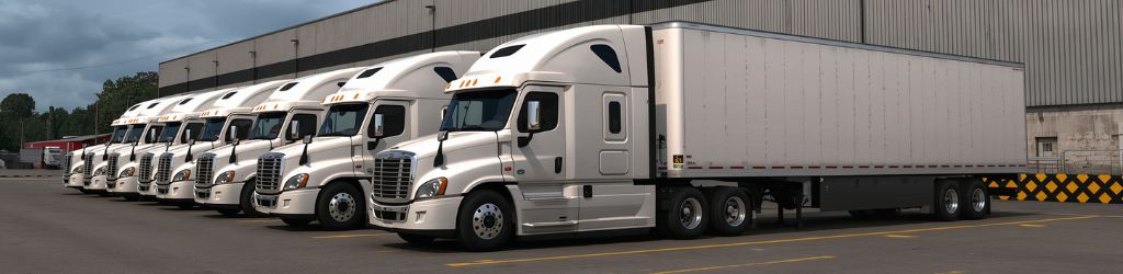Fleet of White Semis at a Loading Dock